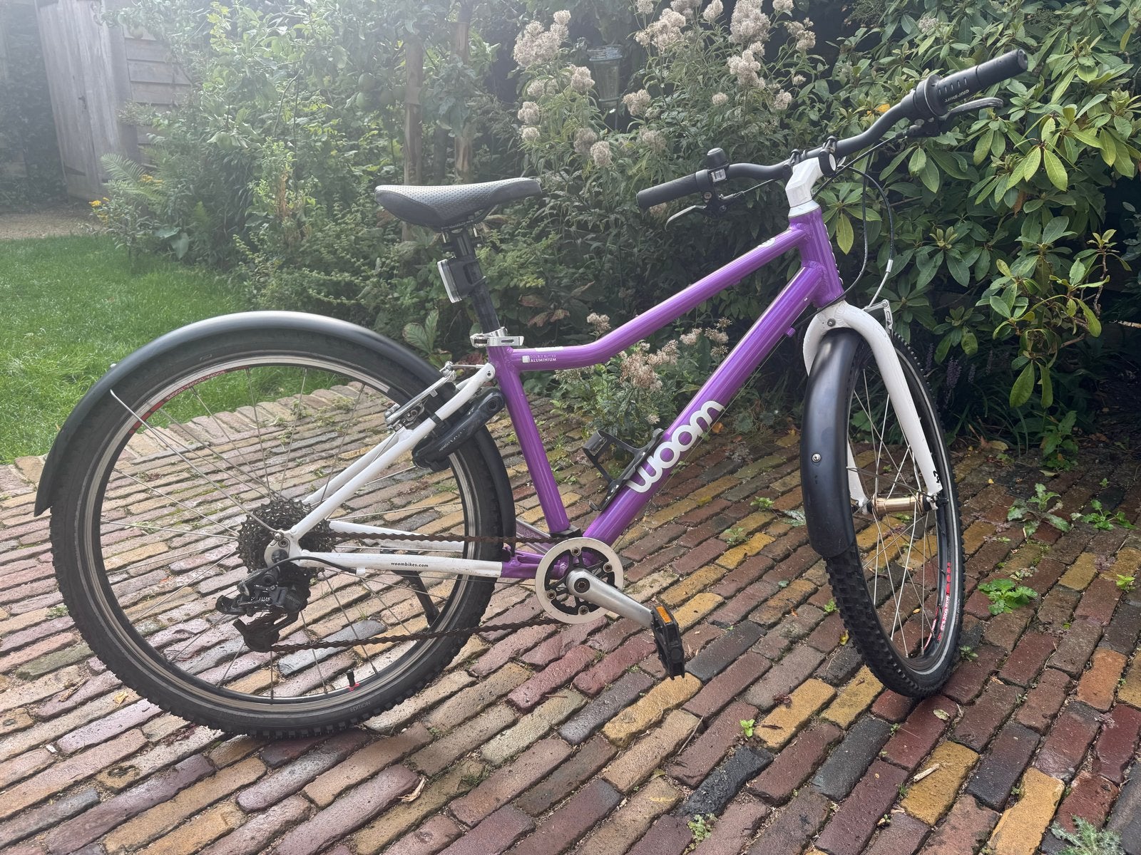 Woom 5 kinderfiets paars, Ophalen, Zo goed als nieuw, Velgrem, 20 inch of meer