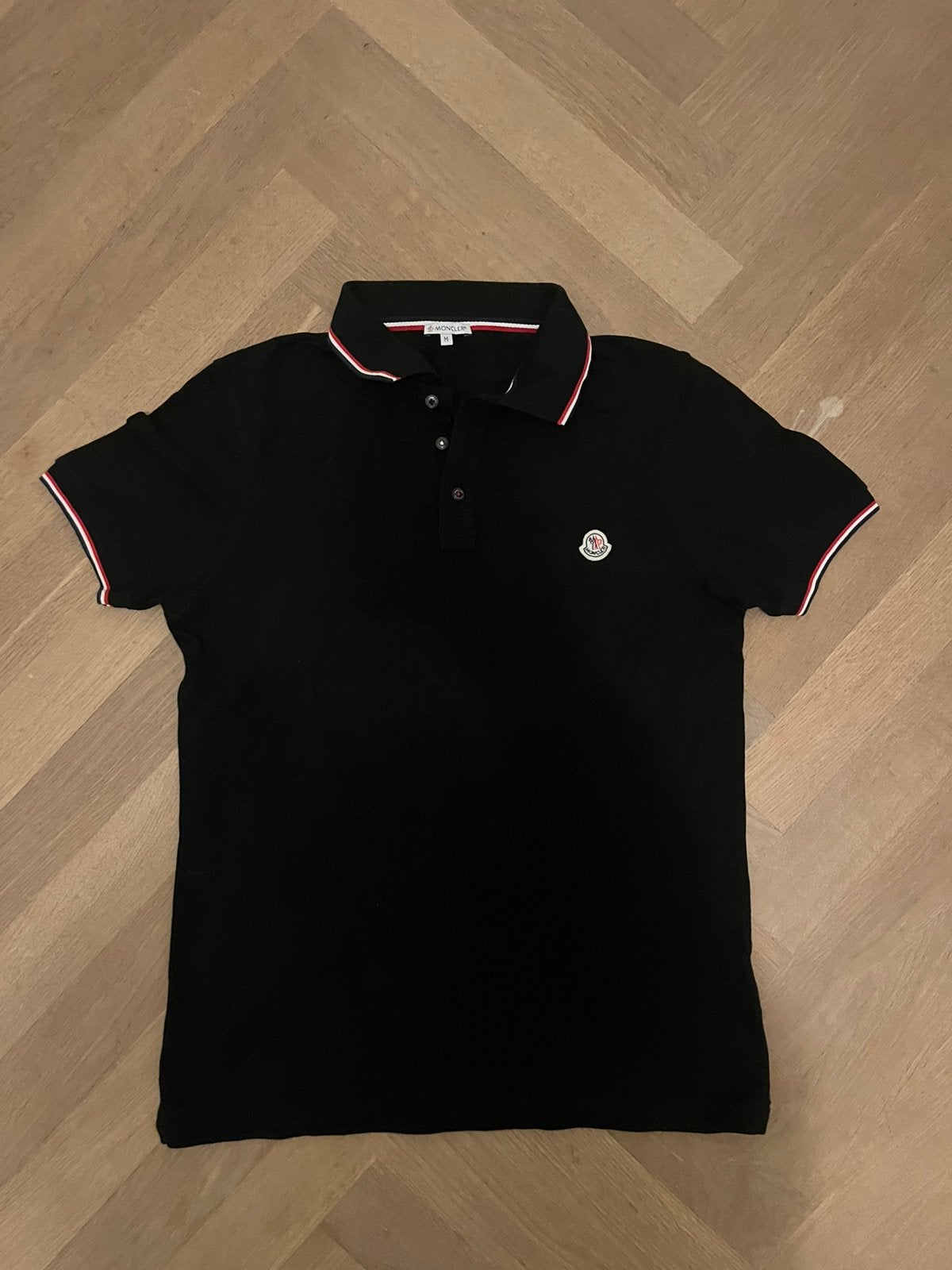 Moncler polo, Verzenden, Zo goed als nieuw, Maat 48/50 (M), Zwart