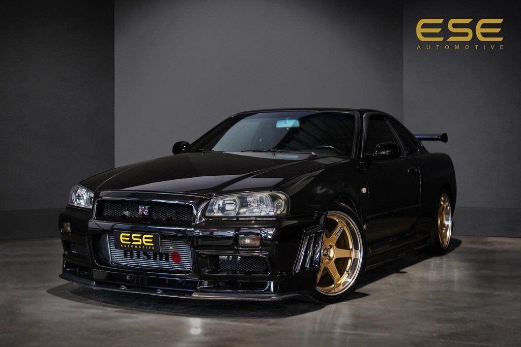 Nissan Skyline R34 GTR V-spec LHD (UK-Spec) 1 of 80, Auto's, Nissan, Stof, Zwart, 2568 cc, Zwart