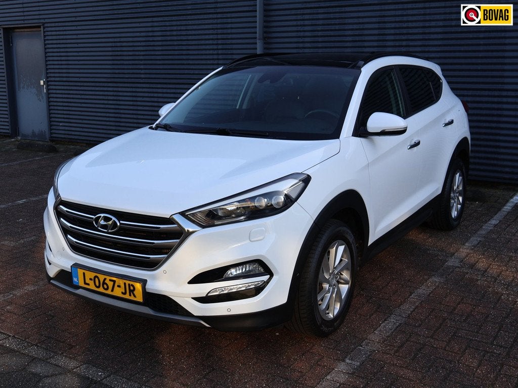 Hyundai Tucson 1.6 T-GDi Comfort 4WD Pano Camera Navi Keyles, Auto's, Hyundai, Gebruikt, 4 cilinders, Wit, Leder