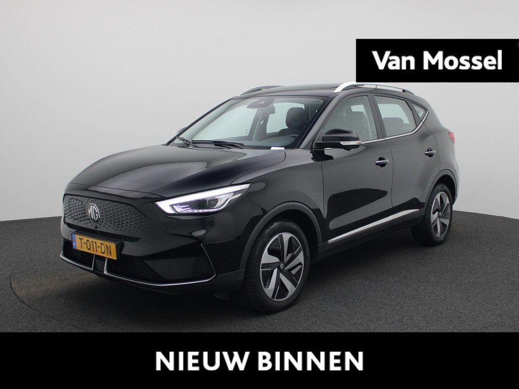 MG ZS EV Long Range Luxury 70 kWh | WLTP 440 | Panorama/Schu, Auto's, MG, 12 maanden, Gebruikt, Zwart, ZS