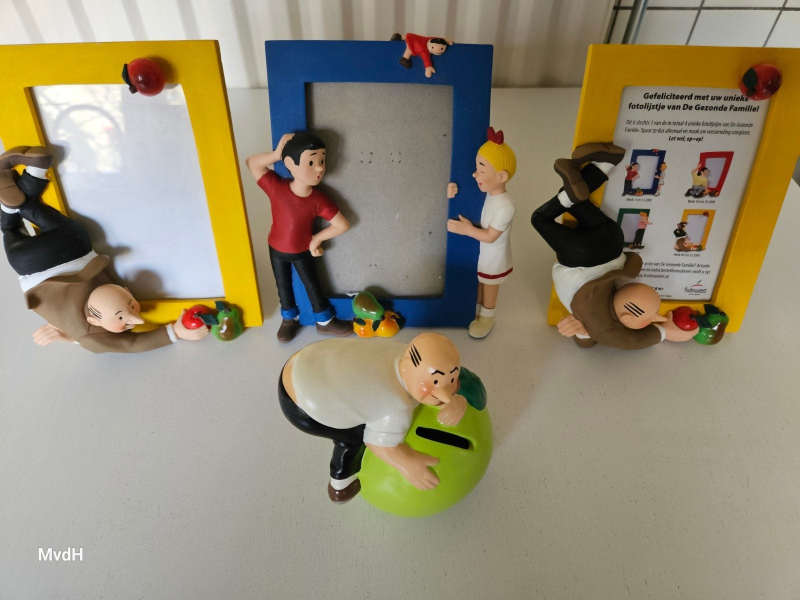 De Gezonde Familie fotolijsten en spaarpot, Kunststof, Gebruikt, Geel, Ophalen of Verzenden