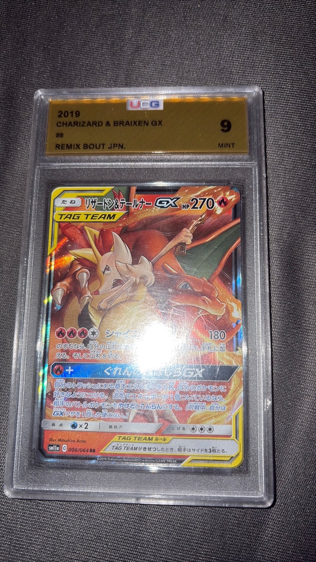 Charizard & Braixen GX tag team 008/064 ucg 9 slab mint, Ophalen of Verzenden, Zo goed als nieuw, Losse kaart