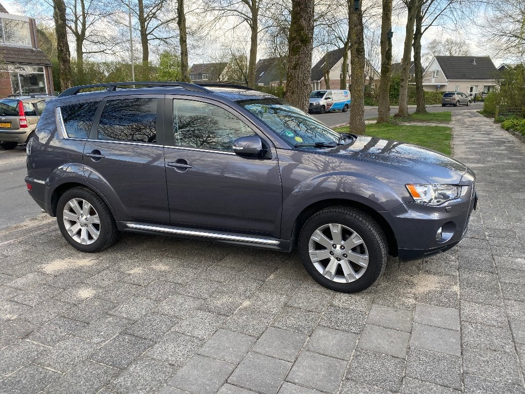 Mitsubishi Outlander 2.2 Di-d AUT Grijs 7 persoons nw.staat!, Auto's, Mitsubishi, Automaat, Euro 5, Outlander, Zwart
