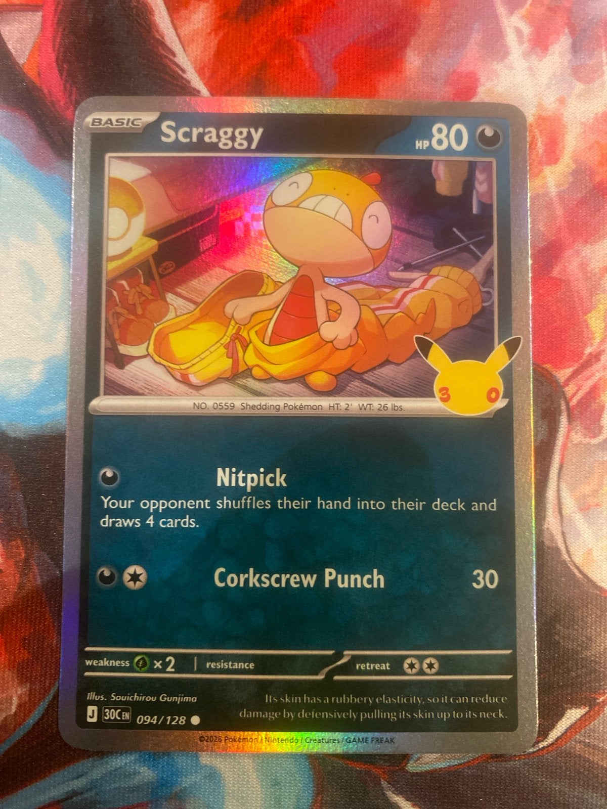30th Pokémon Kaart Scraggy 094/128 Celebrations Foil, Ophalen of Verzenden, Zo goed als nieuw, Losse kaart, Foil
