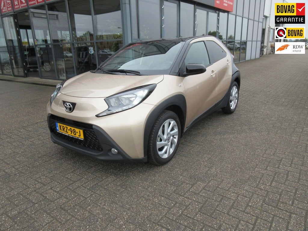Toyota Aygo X 1.0 VVT-i S-CVT Envy, Auto's, Stof, Gebruikt, Euro 6, Bruin