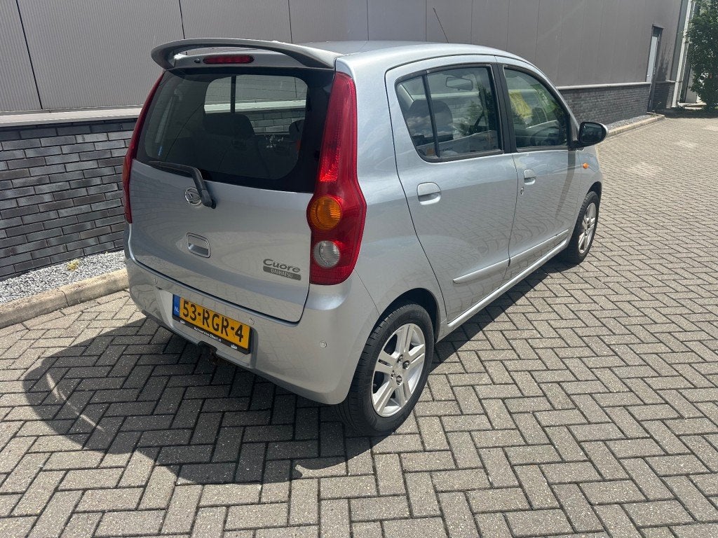 Daihatsu CUORE 1.0i + Airco  km stand Nap, Auto's, Daihatsu, Voorwielaandrijving, 18 €/maand, 4 stoelen, Cuore