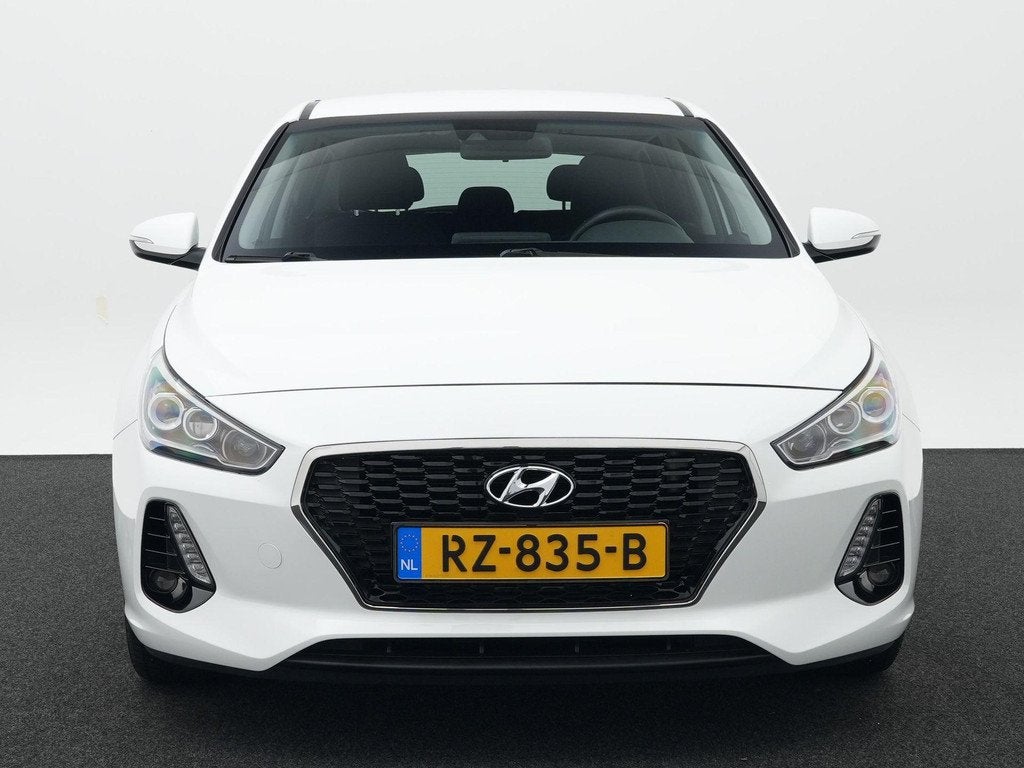 Hyundai i30 1.0 T-GDI Premium | All Season Banden | Cruise C, Auto's, Hyundai, 12 maanden, Euro 6, Leder en Stof, Wit