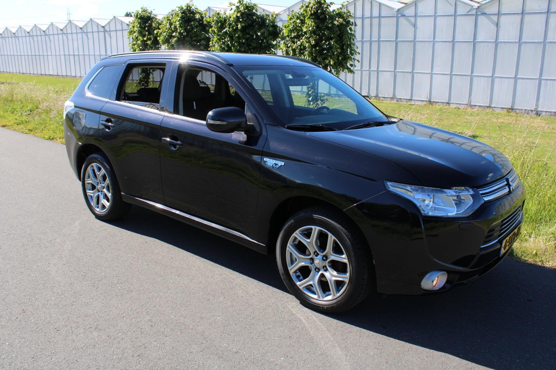 Mitsubishi Outlander 2.0 PHEV Intense + Automaat 4x4, Auto's, 4 cilinders, Leder en Stof, Zwart, Automatische klimaatregeling