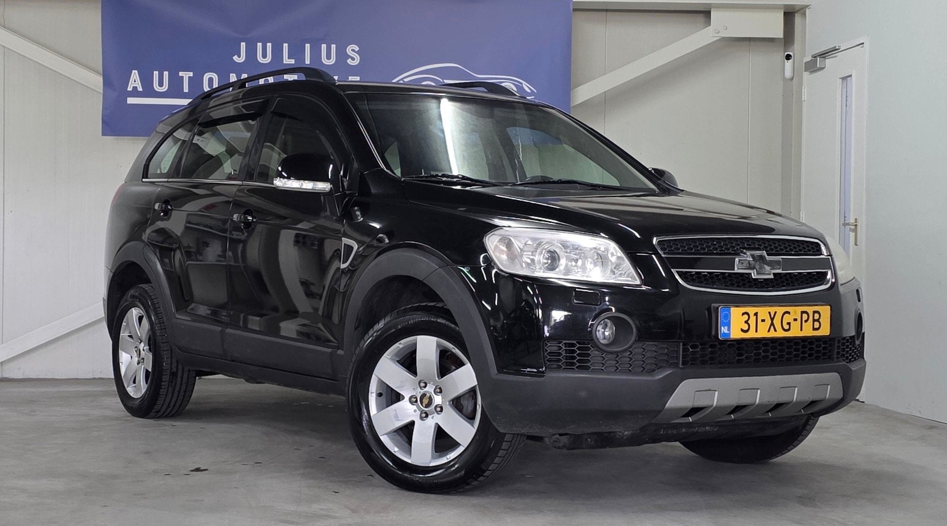 Chevrolet Captiva 2.4i 7P Executive Volledig Onderhouden Lee, Auto's, 136 pk, Gebruikt, Zwart, 4 cilinders