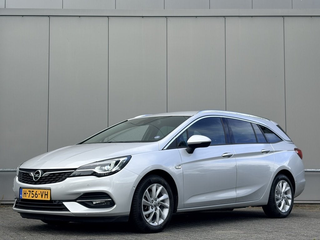 Opel Astra Sports Tourer 1.2 - airco - nap! - navi - cruise, Automatische klimaatregeling, Stof, Gebruikt, Euro 6