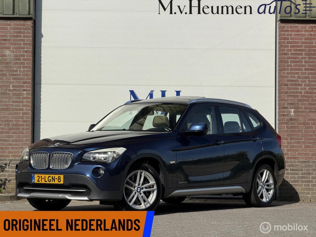 BMW X1 xDrive28i 259PK High Executive Panorama Trekhaak Lede, Auto's, BMW, Euro 5, Gebruikt, Beige, Blauw