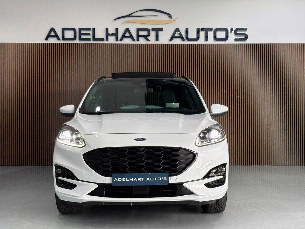 Ford Kuga 2.5 PHEV ST-Line X Automaat / Panorama dak / Adapt, Auto's, Ford, Gebruikt, Zwart, 4 cilinders, Wit