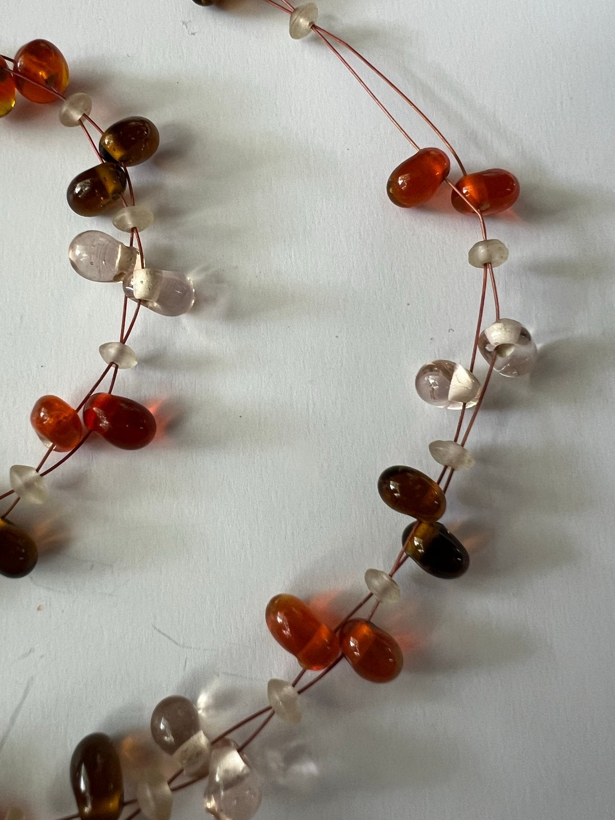 Ketting met oranje, bruine en transparante kralen, Ophalen of Verzenden, Gebruikt, Oranje, Overige materialen