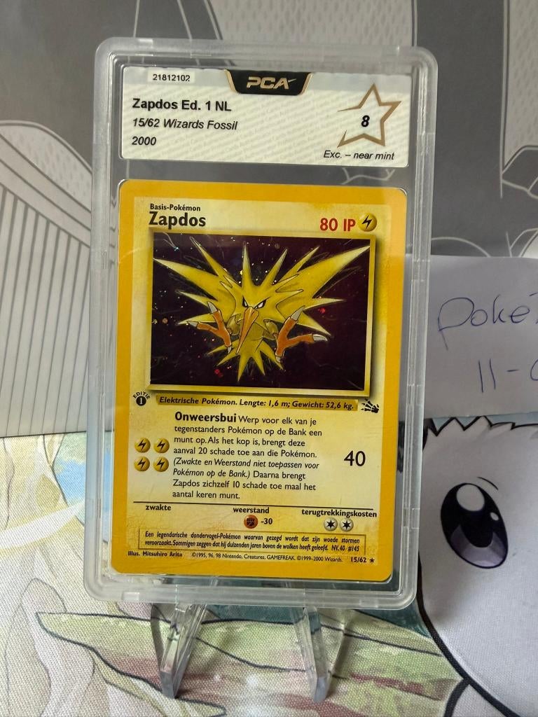 Pokemon TCG Zapdos 1st NL Fossil set 15/62 EXC/NM GRADED 8, Ophalen of Verzenden, Zo goed als nieuw, Losse kaart, Foil