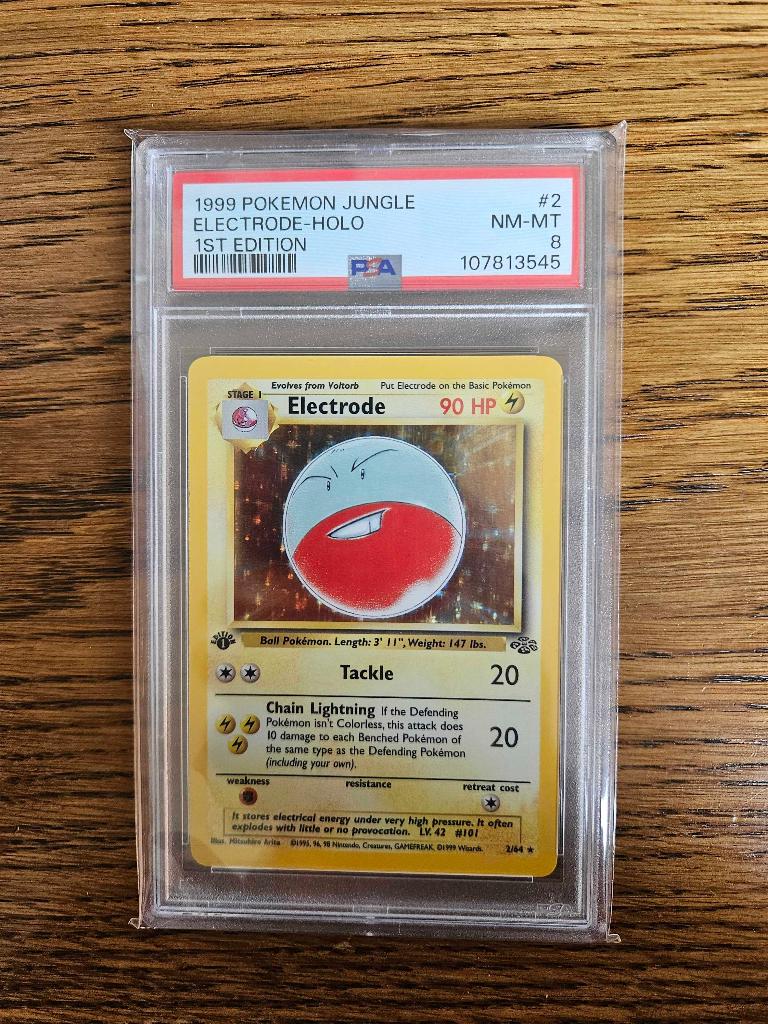 Pokemonkaarten - Electrode 2/64 jungle 1st edition PSA 8, Verzenden, Zo goed als nieuw, Losse kaart, Foil