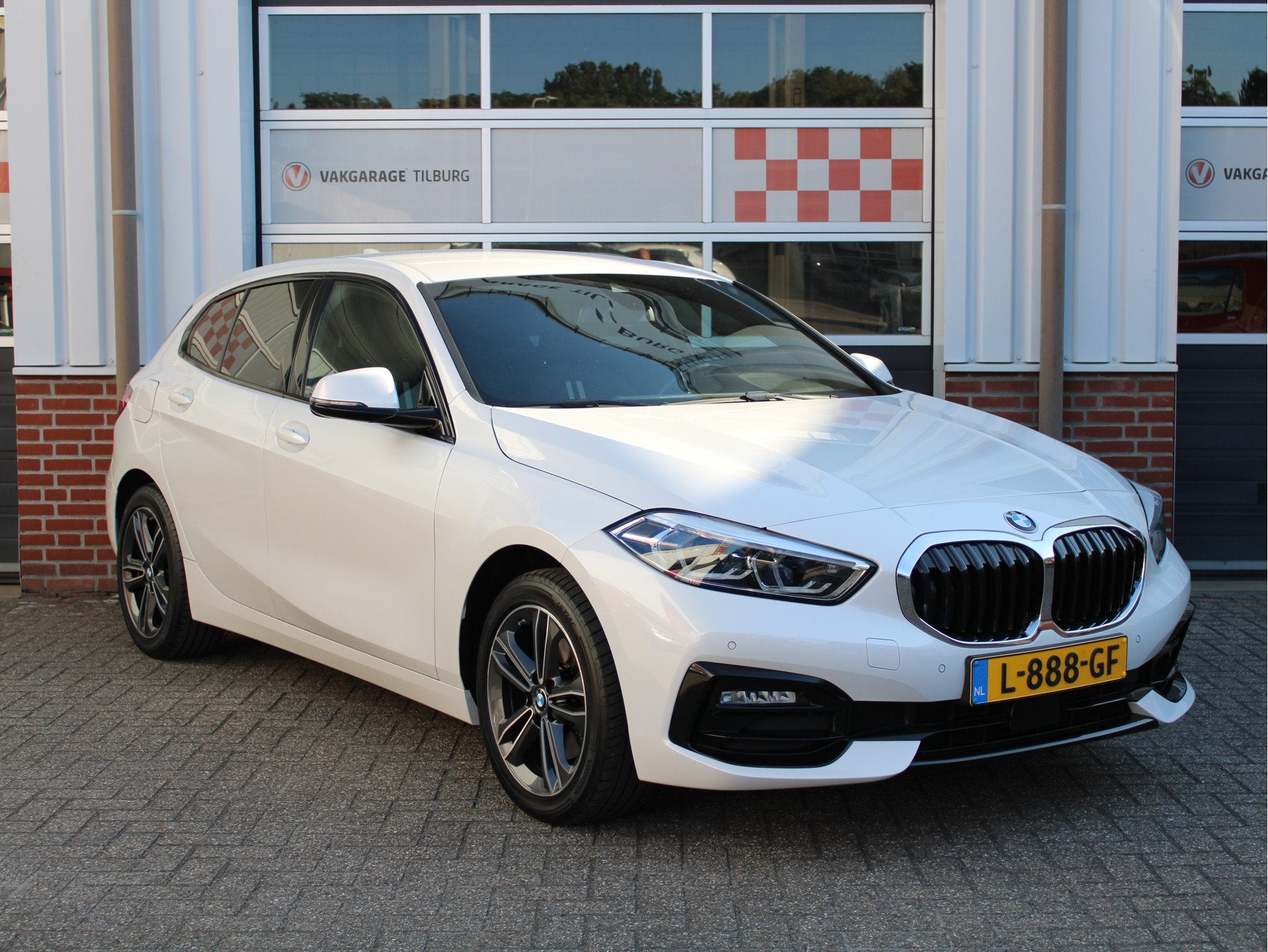 BMW 1-serie 118i Business Edition Sport Automaat Stoelverw/H, Auto's, 136 pk, Gebruikt, Verwarmde buitenspiegels, Leder en Stof
