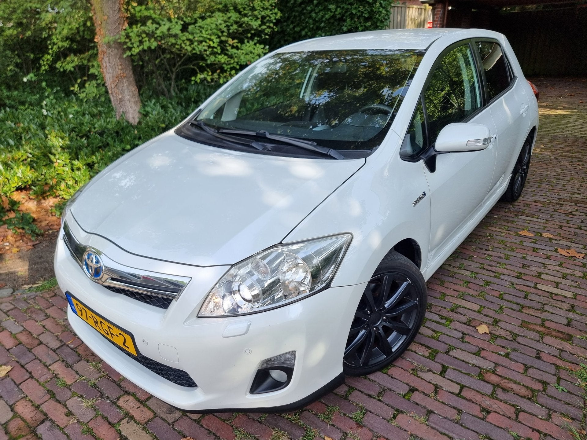 Toyota Auris 1.8 Full Hybrid Executive Xenon/Half Leder/Navi, Auto's, Toyota, Euro 5, Gebruikt, Zwart, 4 cilinders