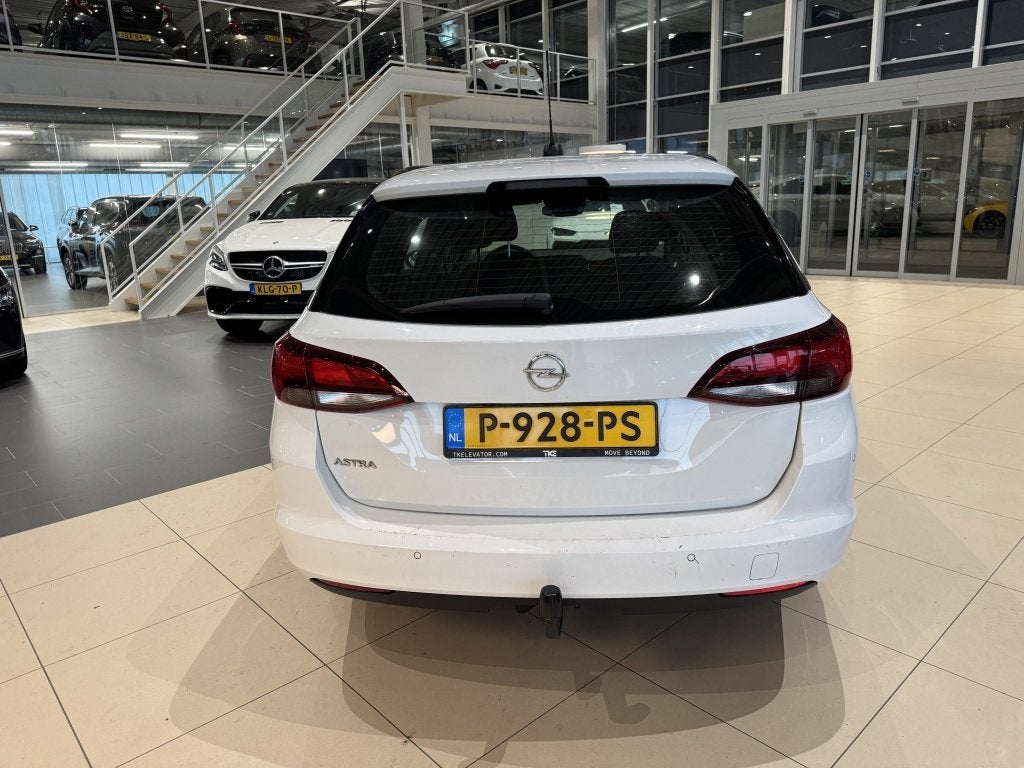 Opel Astra Sports Tourer 1.2 Edition, Auto's, Gebruikt, Euro 6, 1199 cc, Wit