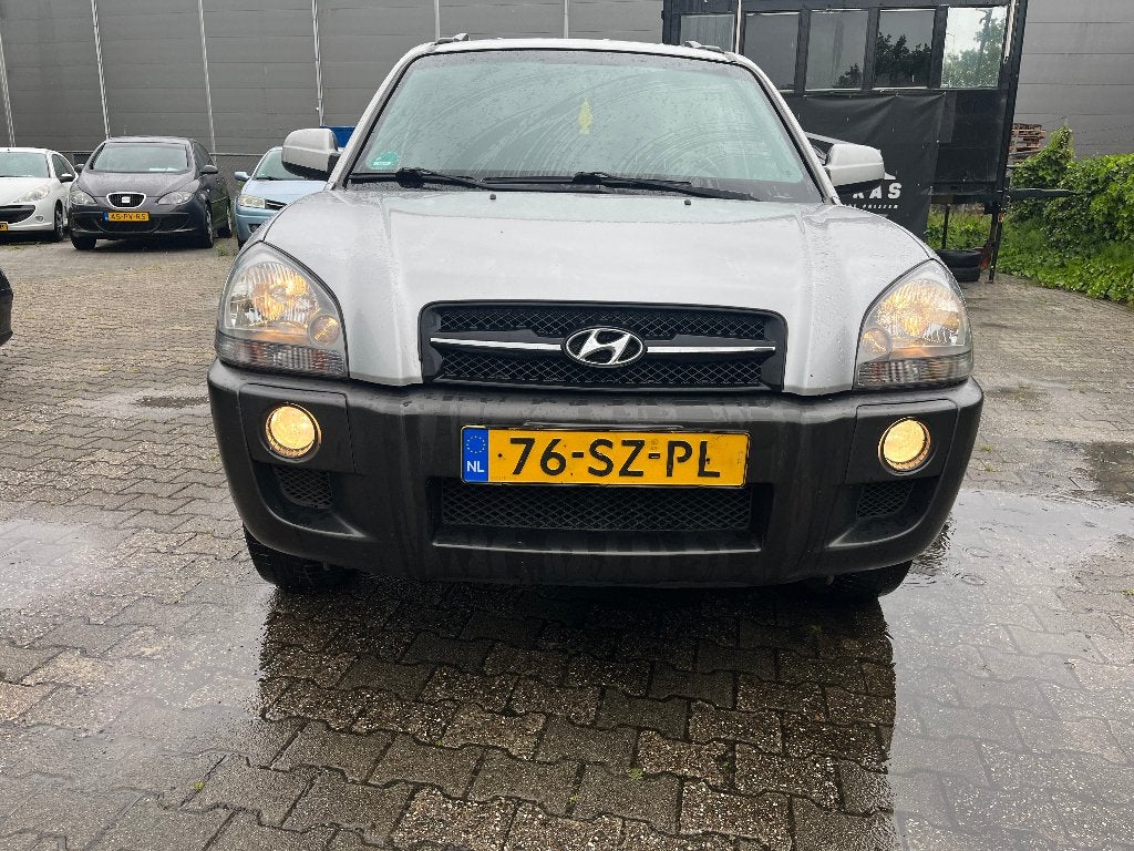Hyundai Tucson 2.0 I 2WD 2006 Grijs, Auto's, Stof, 4 cilinders, Origineel Nederlands, Handgeschakeld