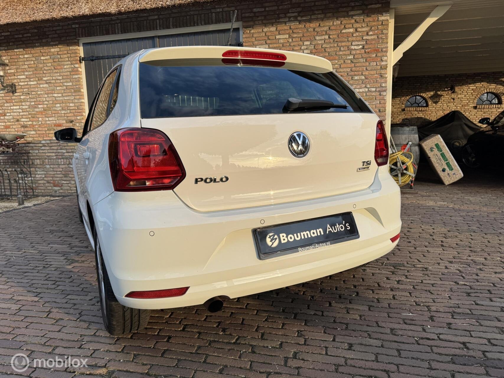 Volkswagen Polo 1.2 TSI Lounge - 5 Deurs - nieuwe apk, Auto's, Verwarmde buitenspiegels, Gebruikt, 4 cilinders, Wit