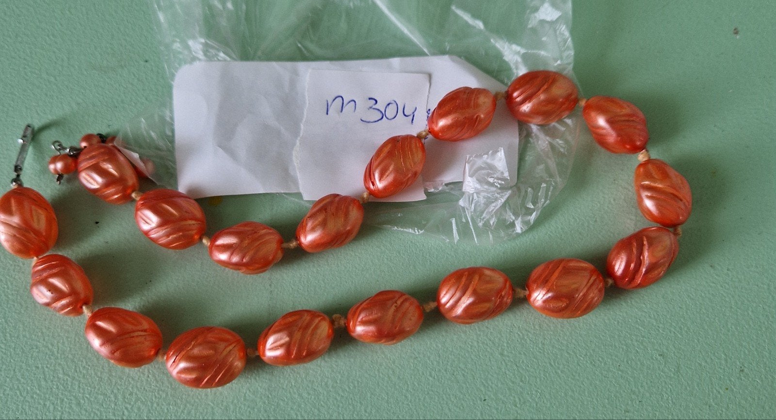 Vintage oranje ketting met ovale kralen, Ophalen of Verzenden, Gebruikt, Oranje, Kunststof