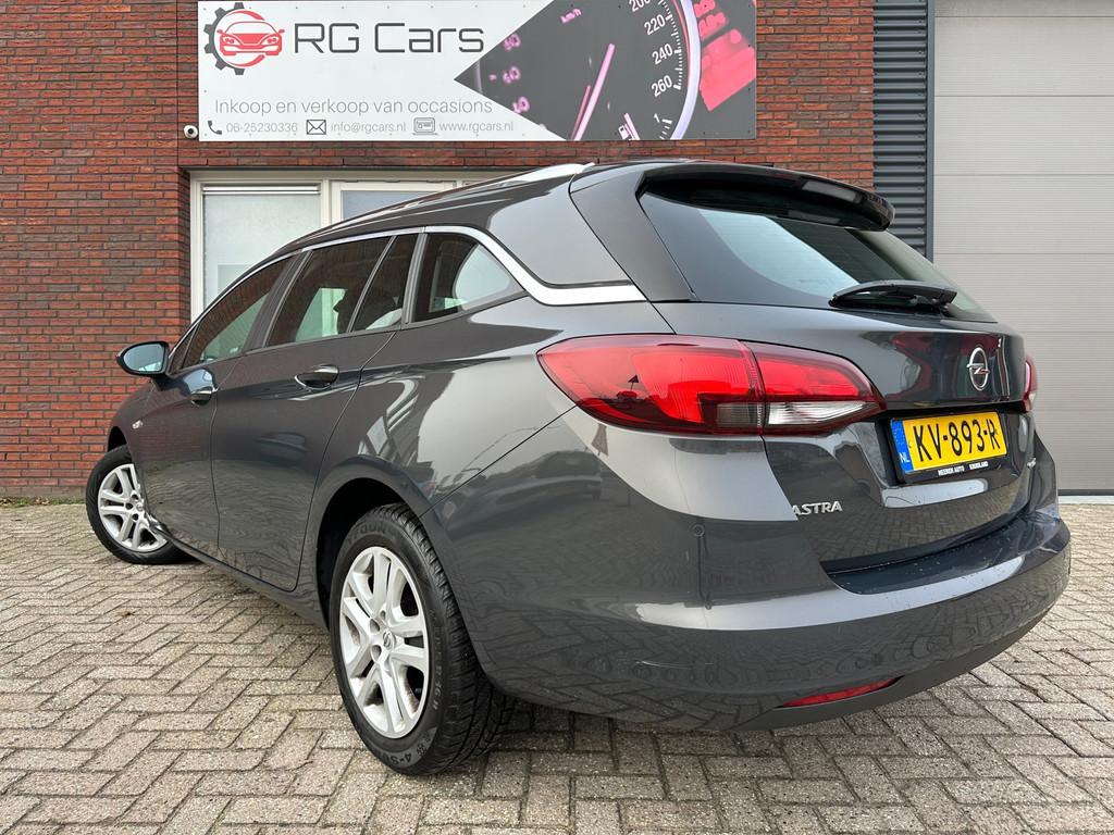 Opel Astra Sports Tourer 1.0 Edition / Airco / Cruise / Navi, Auto's, Voorwielaandrijving, Stof, Gebruikt, Met garantie (alle)