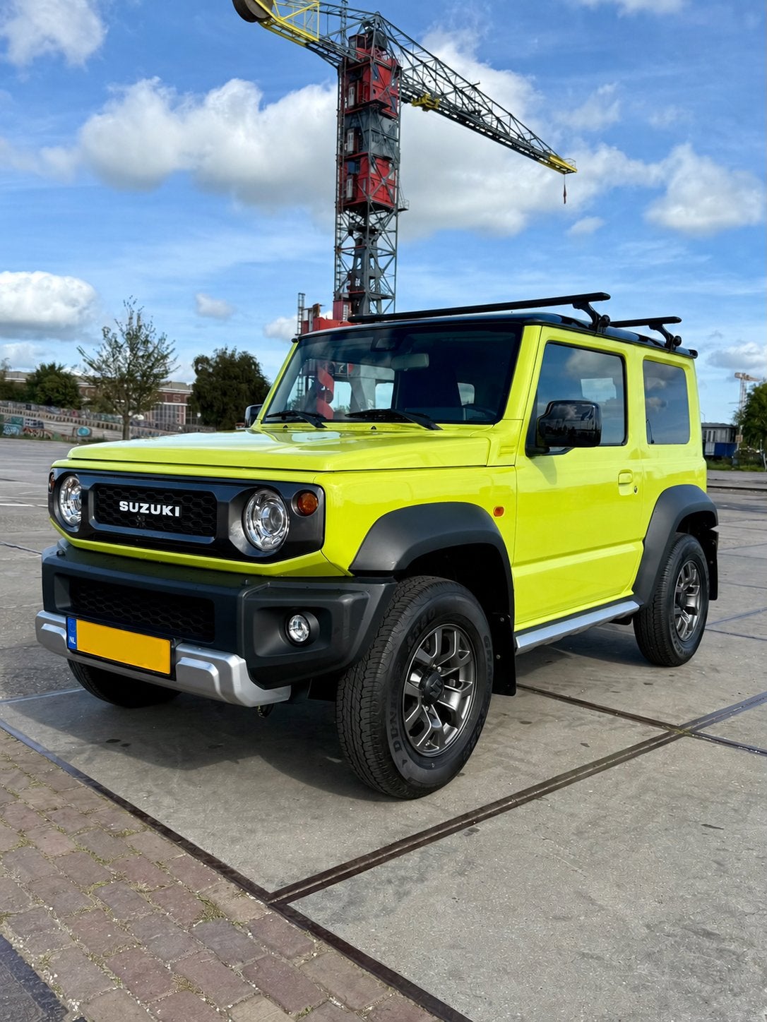 2019 Suzuki Jimny 1.5 Stijl | Geel | Garantie | 76.216 km, Auto's, Dealer onderhouden, 15 km/l, 4 cilinders, 49 €/maand