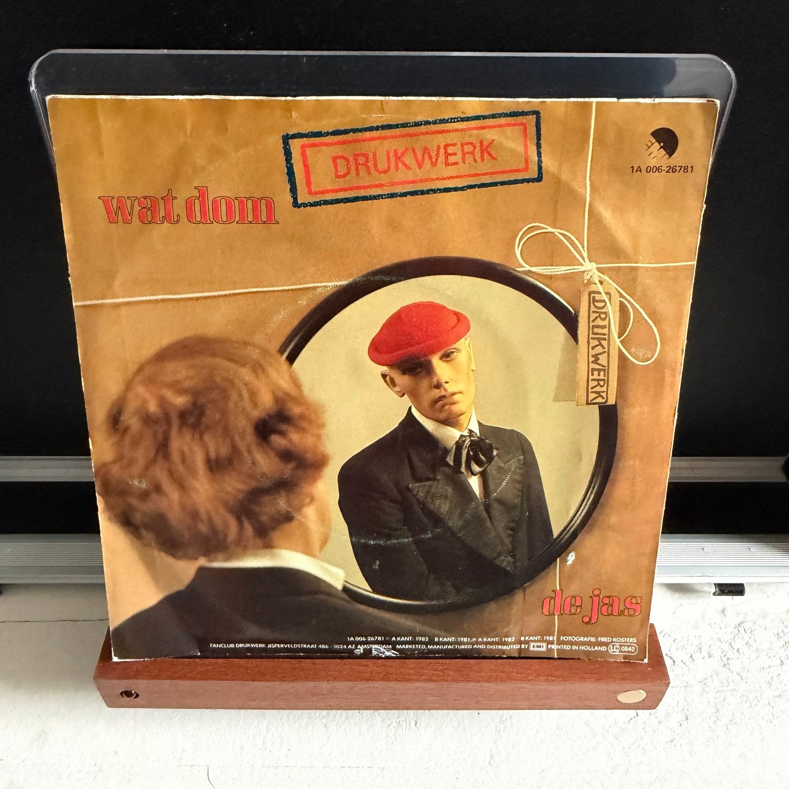 Drukwerk - Wat Dom / De Jas (Vinyl Single), LP, Gebruikt, Originele persing, 7 inch