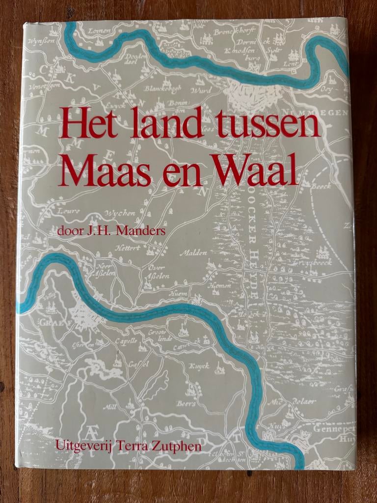 Het land tussen Maas en Waal - J.H. Manders, Ophalen of Verzenden, Zo goed als nieuw, Gelderland
