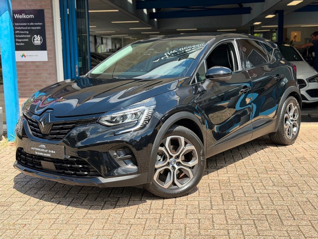 Renault Captur 1.6 E-Tech Hybrid 145 Intens AUT NAVI NAP!, Auto's, 94 pk, Stof, Gebruikt, 715 kg