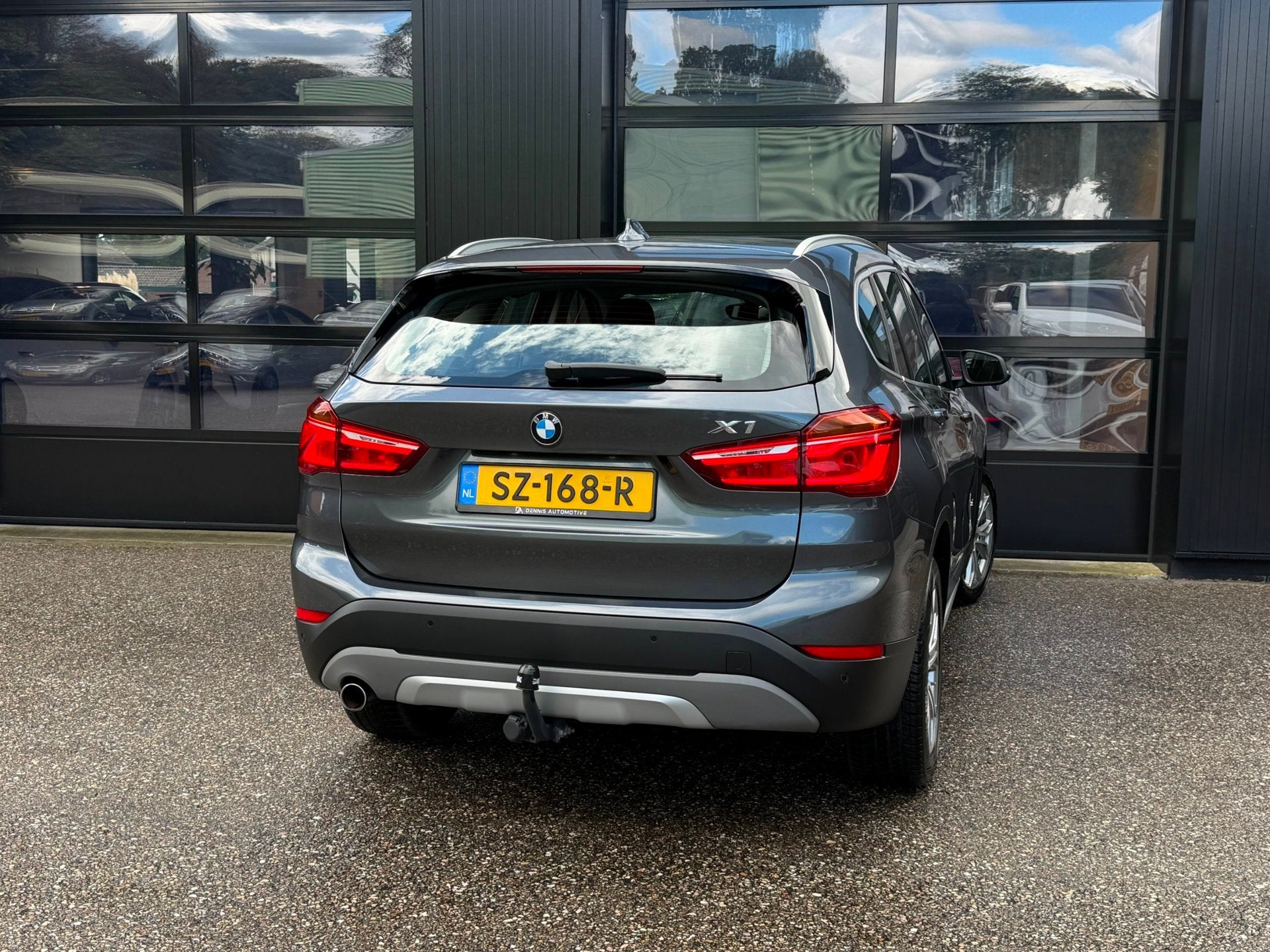 BMW X1 SDrive18i High Executive Xenon Navi Trekh. Cruise, Auto's, Gebruikt, Euro 6, Leder en Stof, 19 km/l
