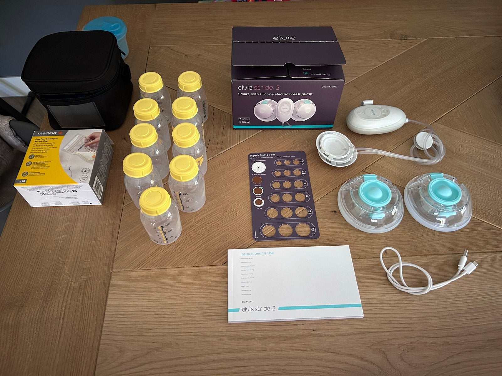Elvie Stride 2 dubbele Borstkolf met Medela accessoires, Ophalen of Verzenden, Zo goed als nieuw, Borstkolf