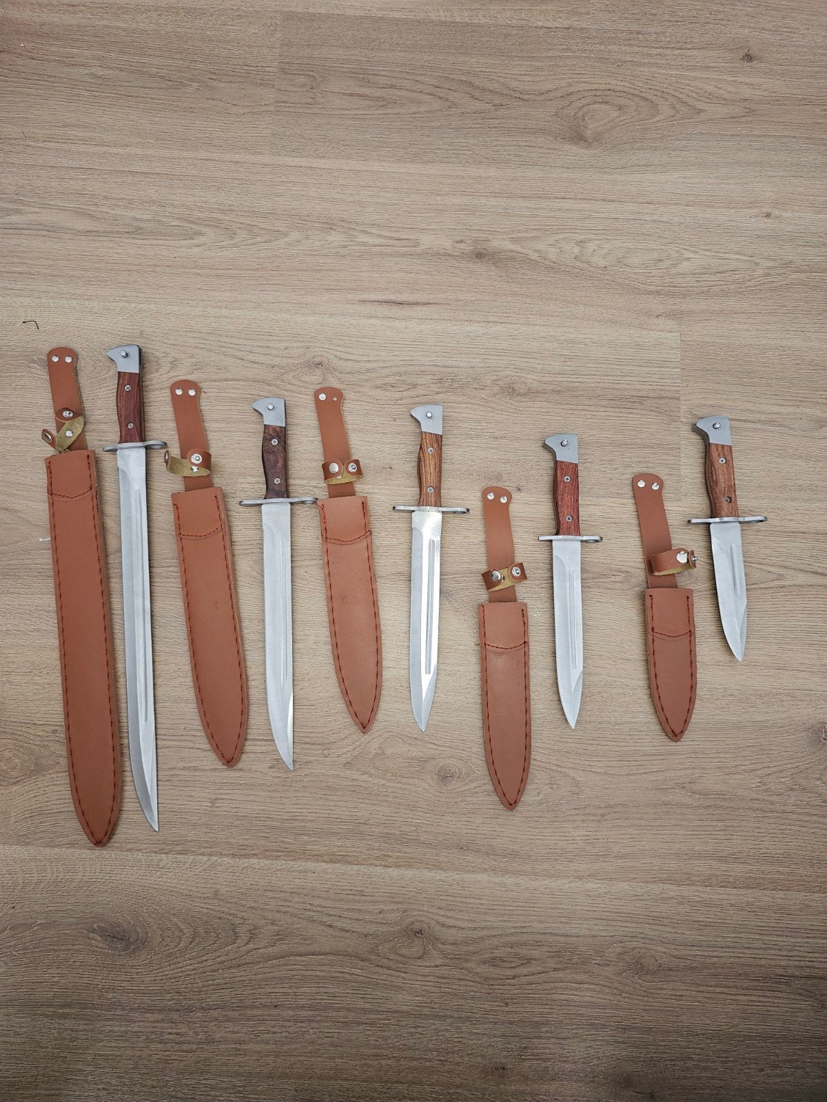 Set van 5  ak bajonetten/dolken met leren schede, Ophalen of Verzenden