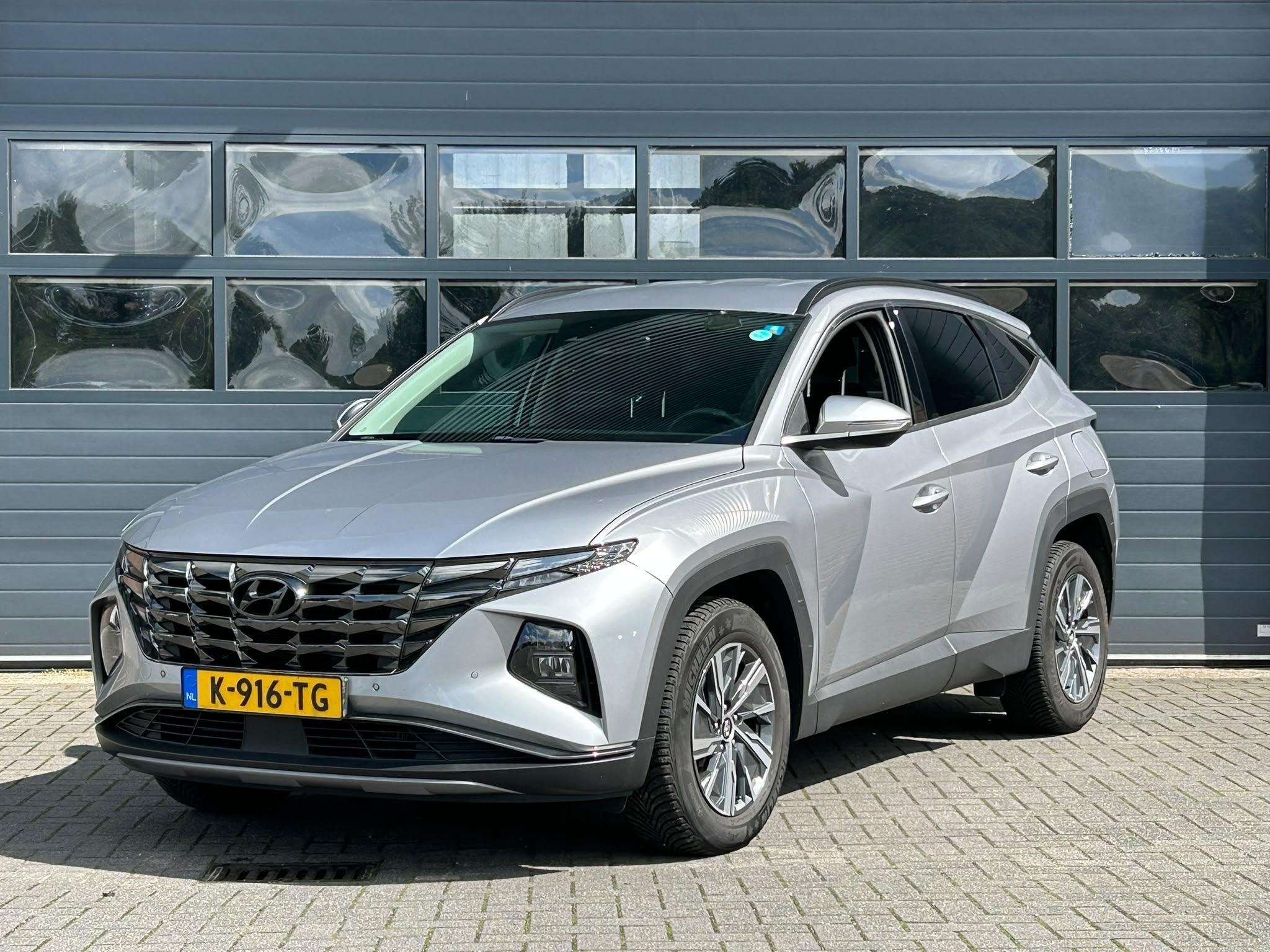 HYUNDAI TUCSON 1.6 T-GDI HEV COMFORT SMART I AUTOMAAT I CLIM, Auto's, Stof, Gebruikt, 4 cilinders, Met garantie (alle)