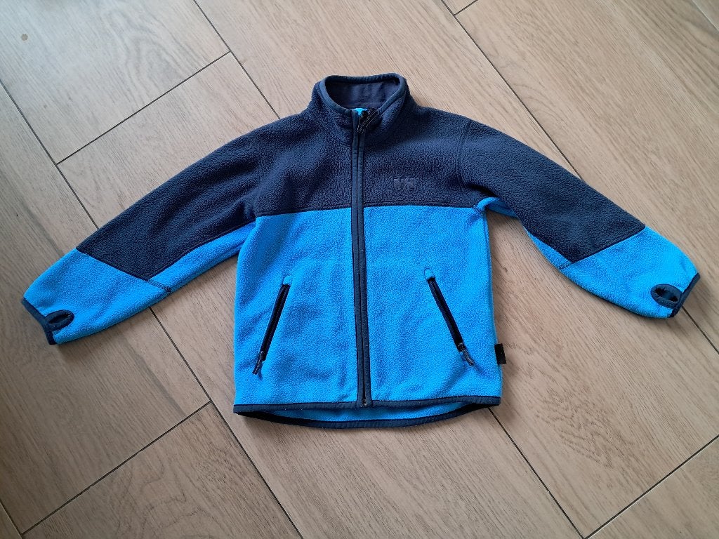 K317 Blauw fleecevest Helly Hansen maat 110, Gebruikt, Trui of Vest, Ophalen of Verzenden, Jongen