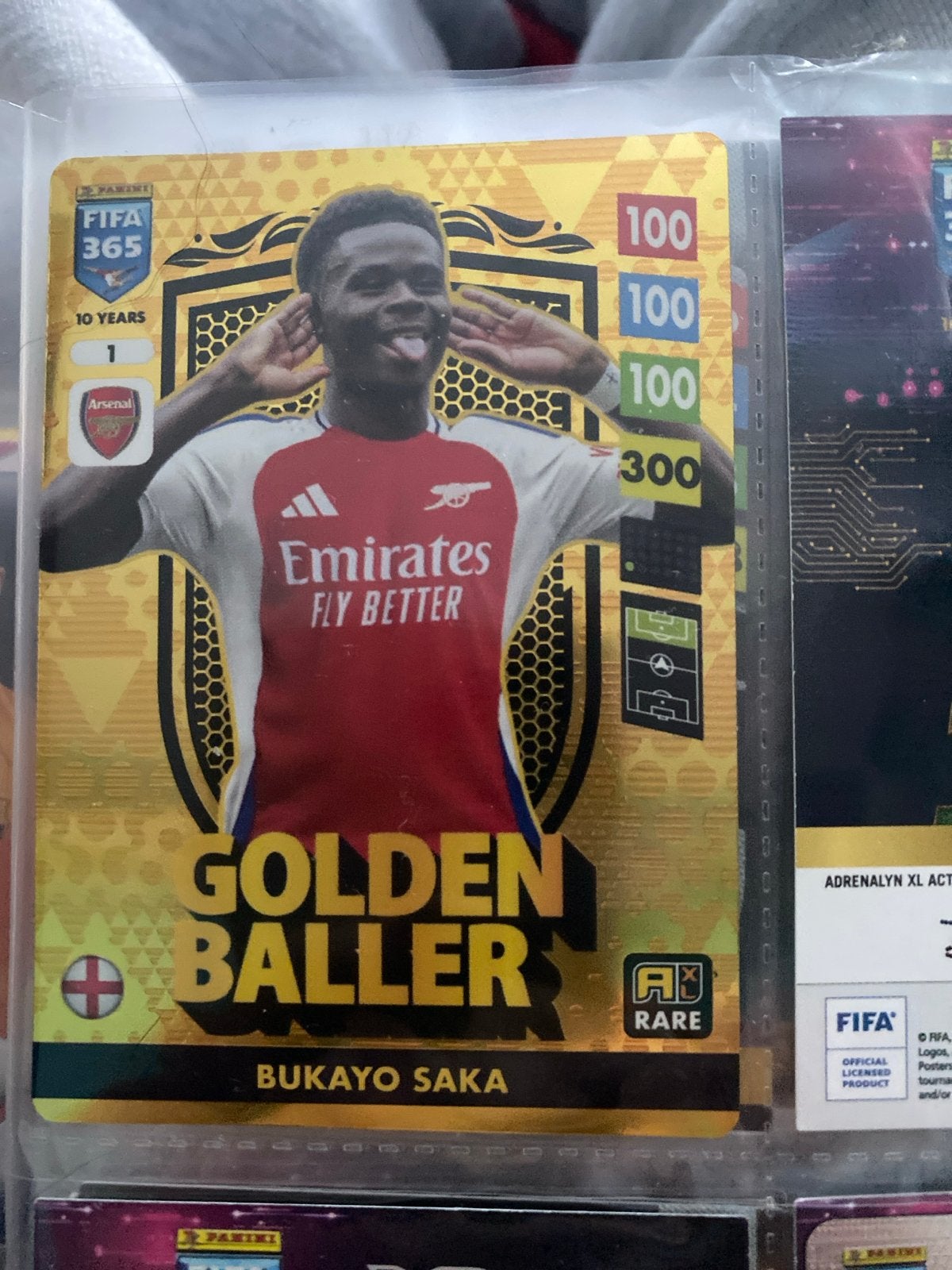Panini FIFA 365 Golden Baller Bukayo Saka Arsenal, Ophalen of Verzenden, Zo goed als nieuw, Buitenlandse clubs, Spelerskaart