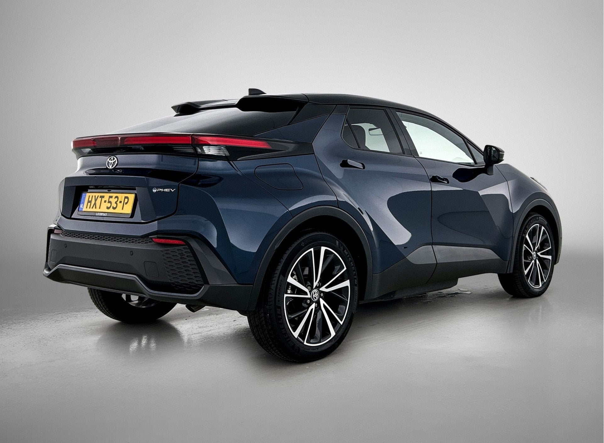 Toyota C-HR Plug-in Hybrid 220 Executive | Sportstoelen | Pa, Auto's, Toyota, 12 maanden, 4 cilinders, Blauw, Leder en Stof