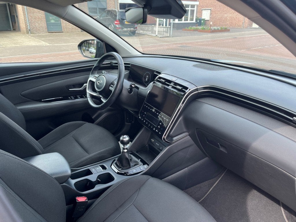 Hyundai TUCSON 1.6 T-GDI MHEV / NAVI / CAMERA / STOELVERW. /, Auto's, Voorwielaandrijving, 15 km/l, Gebruikt, 4 cilinders