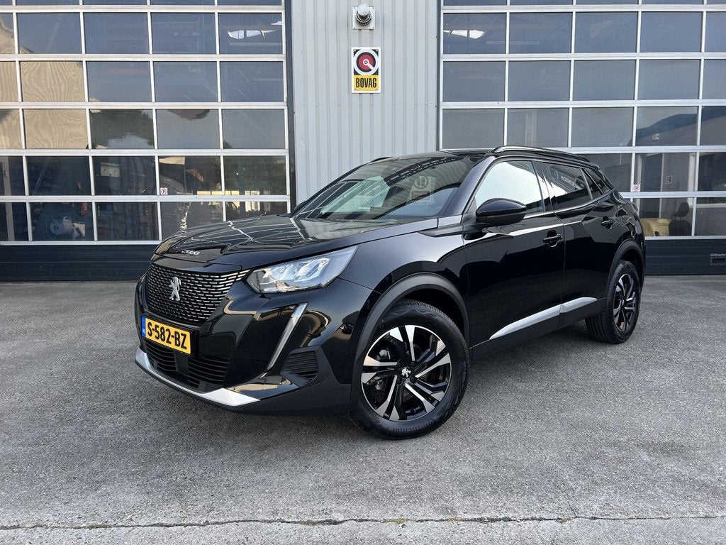 Peugeot 2008 1.2 PureTech Allure Navi Apple Carplay, Gebruikt, Euro 6, 1199 cc, Leder en Stof