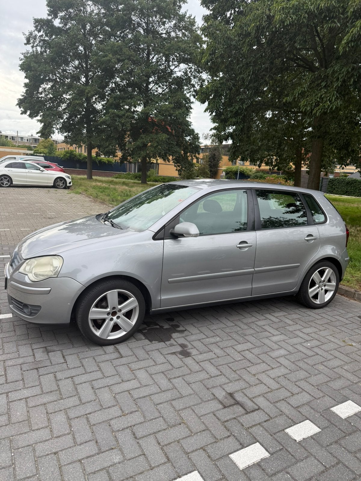 Volkswagen Polo 1.4 16V 59KW 2007 Grijs, Auto's, Voorwielaandrijving, 4 cilinders, Handgeschakeld, Particulier