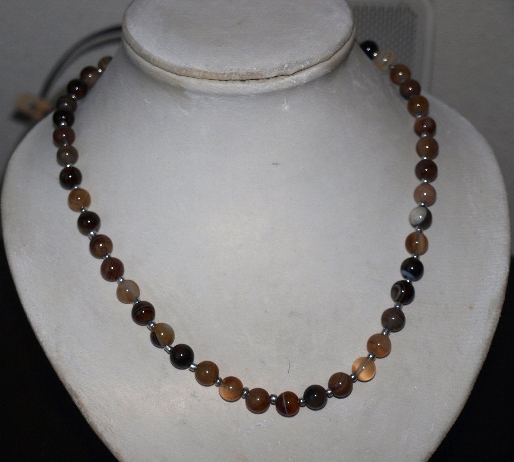 ketting van bruin gestreept agaat  49 cm lang, Sieraden, Tassen en Uiterlijk, Kettingen, Ophalen of Verzenden, Nieuw, Bruin, Steen of Mineraal