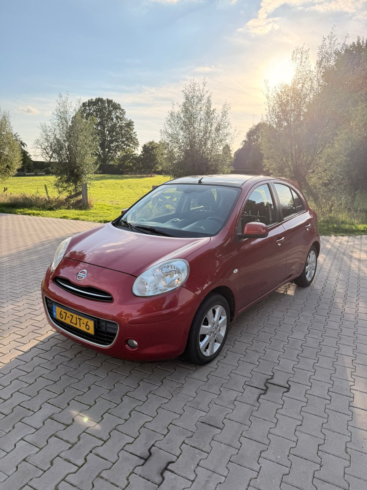 Nissan Micra 1.2 72KW 5DR 2012 Rood vol optie’s!, Voorwielaandrijving, Euro 5, 40 €/maand, Zwart