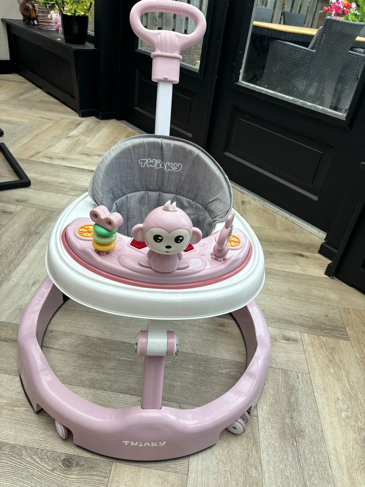 Roze Twinky loopstoel met duwstang en speelgoed, Ophalen, Gebruikt, Overige typen, Met wieltjes