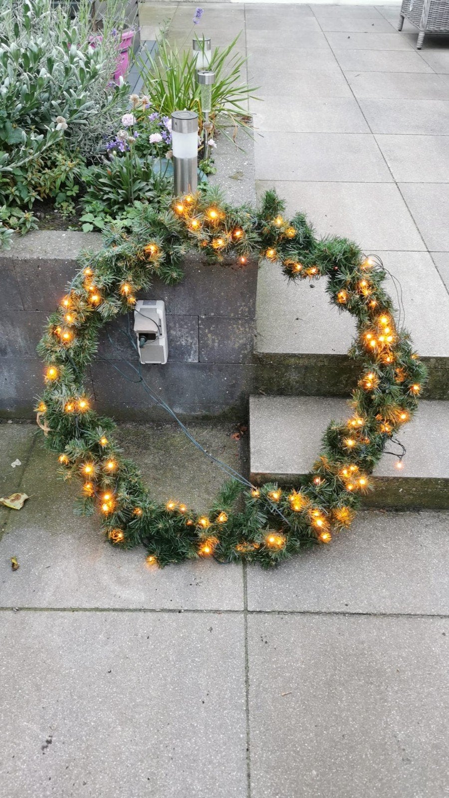 krans met verlichting, Ophalen