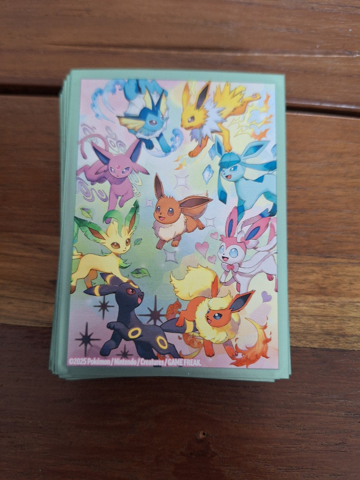 54 prismatic eeveelutions sleeves, Hobby en Vrije tijd, Ophalen of Verzenden, Zo goed als nieuw, Sleeves of Kaarthoesjes