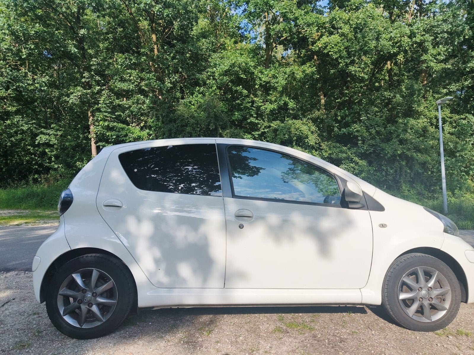 Toyota Aygo 1.0 12V Vvt-i 5DRS 2011 Wit, Auto's, Toyota, Voorwielaandrijving, 4 stoelen, Origineel Nederlands, Handgeschakeld