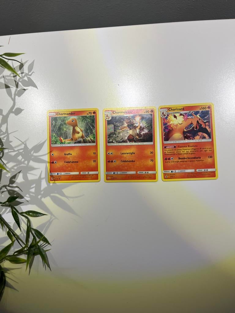 Setje Charizard alle evoluties pokemonkaart, Ophalen of Verzenden, Zo goed als nieuw, Meerdere kaarten