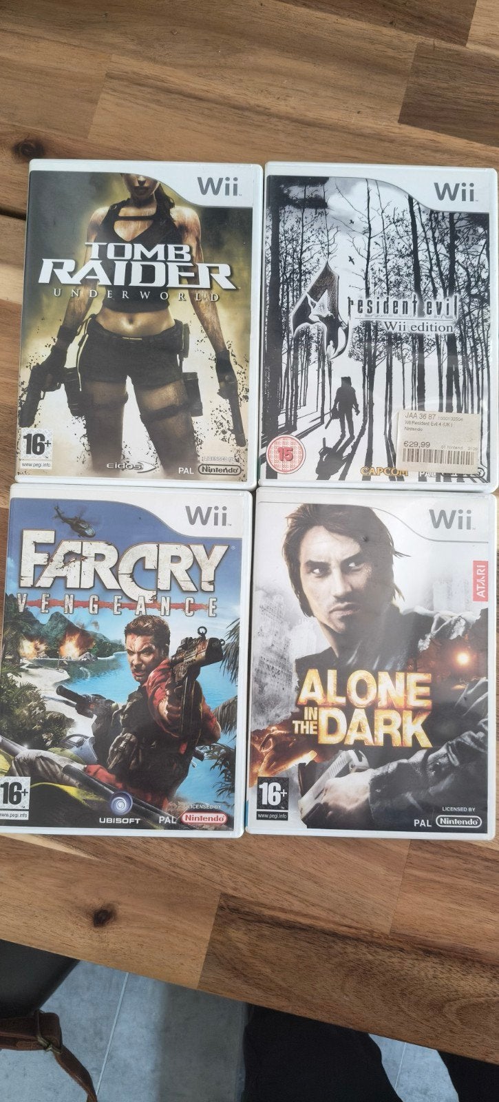 4 Wii games: Resident, Alone in the Dark, Tomb Raid, Farcry, Ophalen