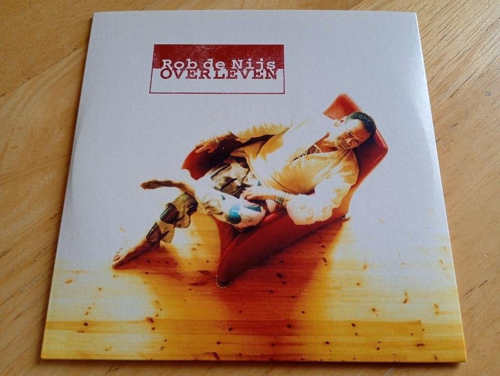 CD Rob de Nijs - Overleven + 5 extra tracks, Verzenden, Zo goed als nieuw, Levenslied of Smartlap